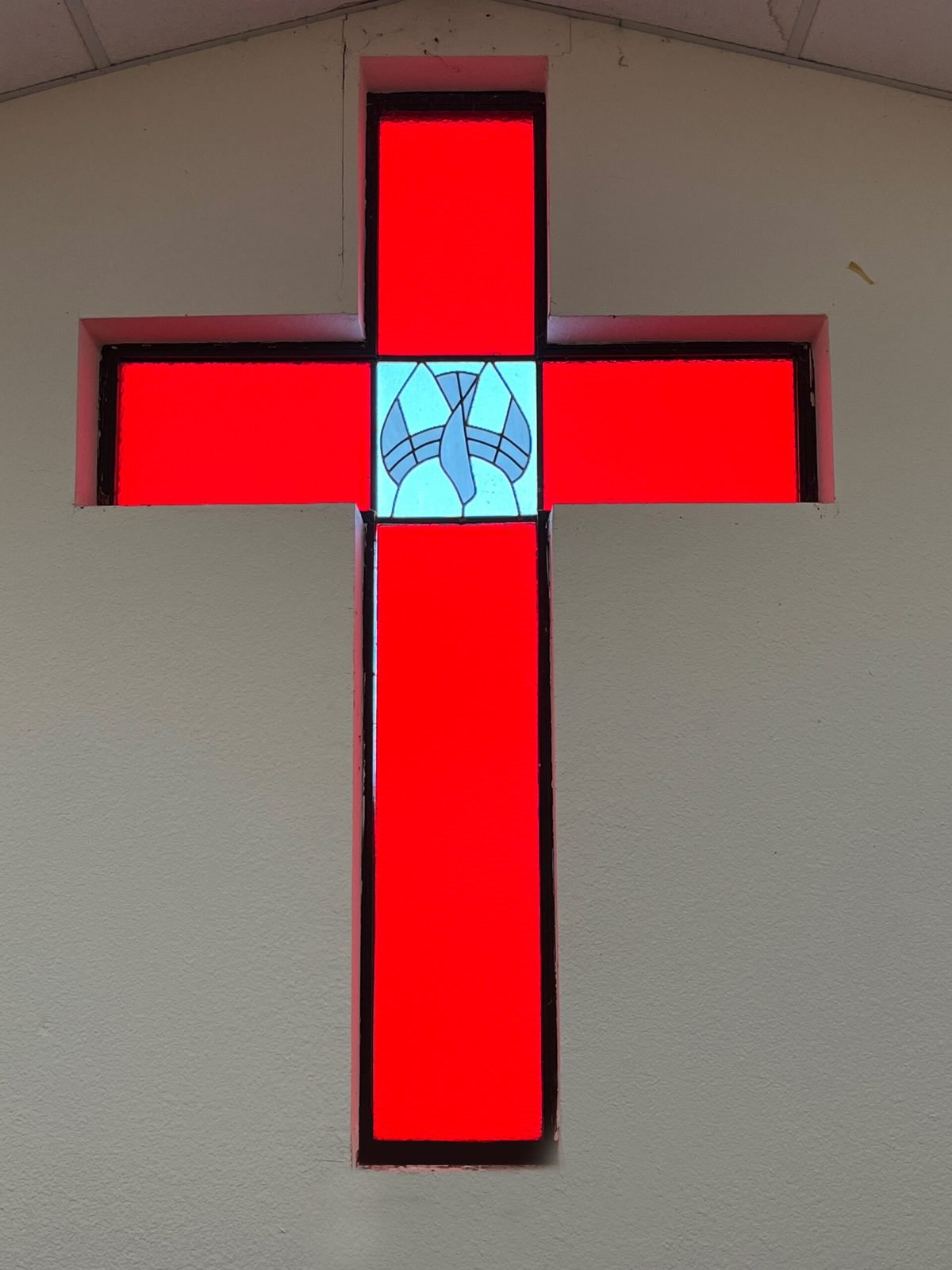 The cross at the front of the sanctuary